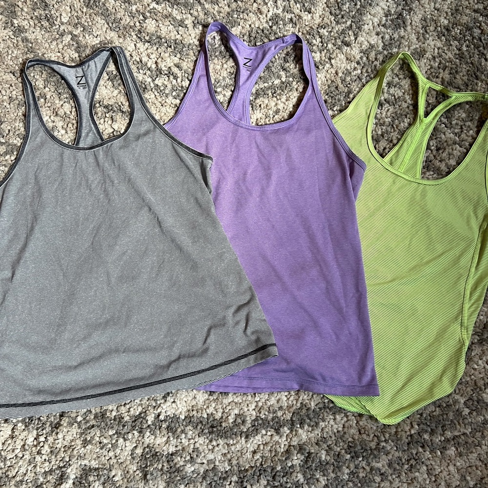 3 Zella Razorback striped tanks Lg (purple & lime green) & Med (black/gray)